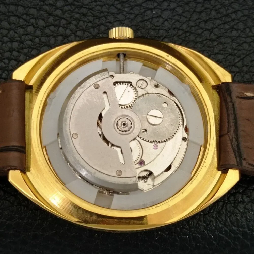 Vintage 1976 HMT Automatic Wound Mens Gold Watch W/daydate & Red accents